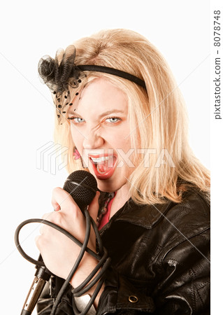 Pretty young singer or comedian with microphone 8078748