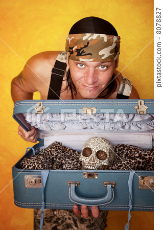 Man with skull in suitcase 8078827