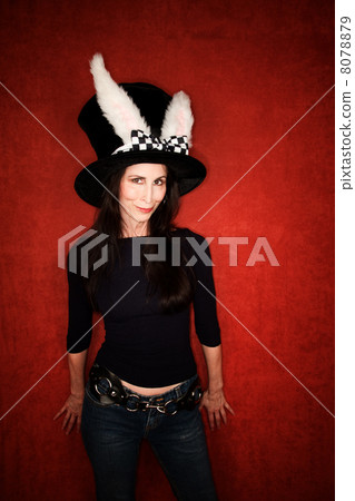 Woman in big hat with rabbit ears 8078879