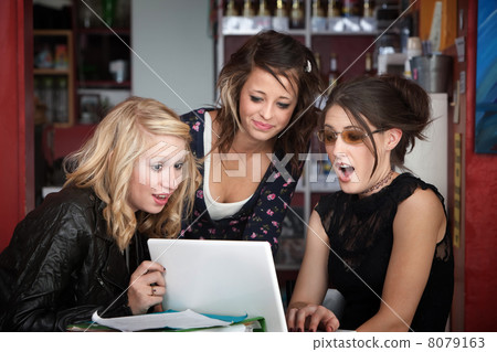 Surprised Girls Looking at a Laptop Surprised Girls Looking at a Laptop 8079163