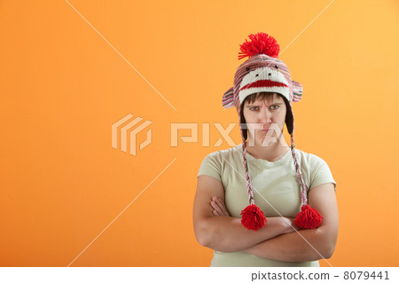 Upset young Caucasian woman in Monkey Cap 8079441