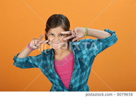 Little Girl making hand gesture Little Girl making hand gesture 8079656