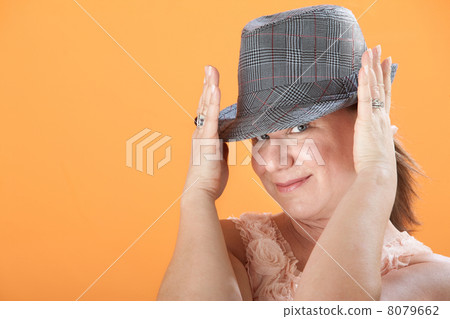 Woman Holds Her Hat 8079662
