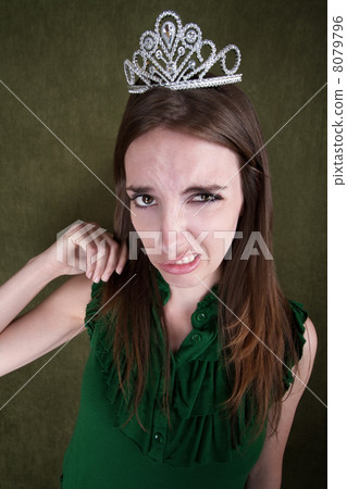 Disgusted Young Woman in Crown 8079796