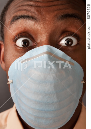 Frightened Man in Surgical Mask 8079826
