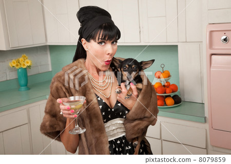 Woman Holds a Chihuahua 8079859