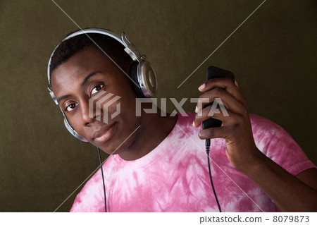 Serious Young Man with Headphones 8079873