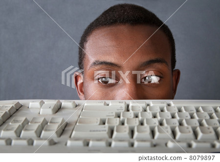 Eyes of Man Above Keyboard 8079897