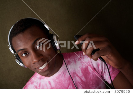 Young Man Listens to Music 8079930