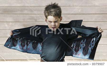 Boy opening his shirt Boy opening his shirt 8079987