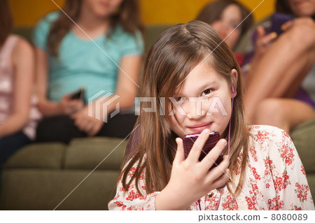 Little Girl Listens To Music 8080089