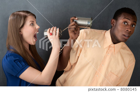 Woman Yelling at Man Through Stringed Cans 8080145