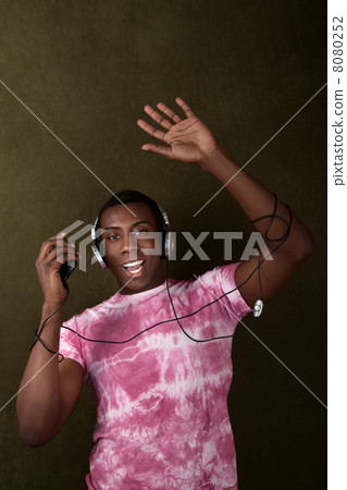 Man with Headphones Waves His Hand 8080252