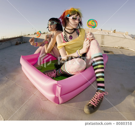 Girsl on a roof in a plastic pool 8080358
