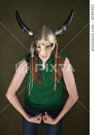 Woman in Viking Helmet Flexes Her Muscles Woman in Viking Helmet Flexes Her Muscles 8080402