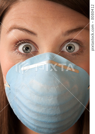 Frightened Woman with Surgical Mask Frightened Woman with Surgical Mask 8080412