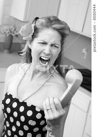 Woman Yells at a Phone Woman Yells at a Phone 8080444