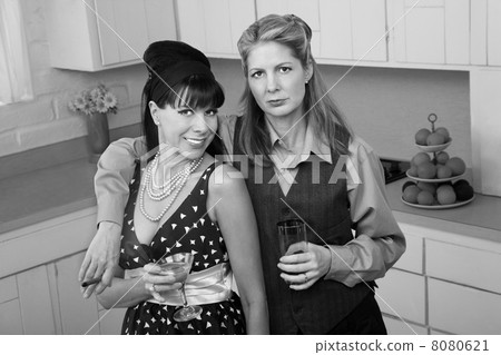 Pair of Women Enjoy A Drink 8080621