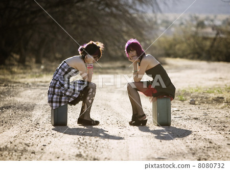 Girsl waiting on a rural road Girsl waiting on a rural road 8080732