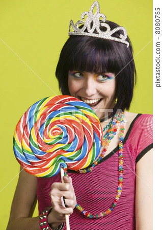 Stock Photo: Young punk woman with a big lollipop