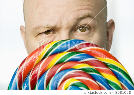 Man Peeking Out From Behind A Lollipop Man Peeking Out From Behind A Lollipop 8081038