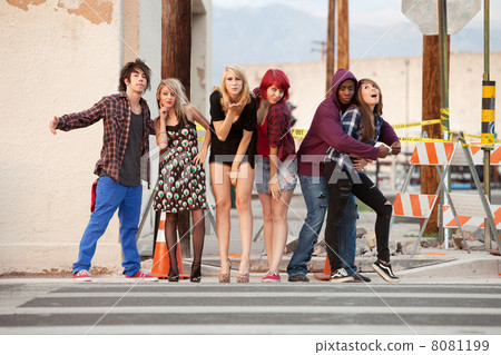Fun loving group of punky teens pose for the camera Fun loving group of punky teens pose for the camera 8081199