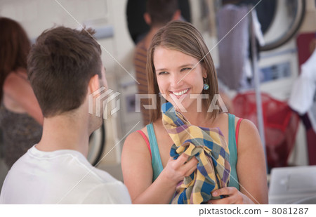 Flirting Woman in Laundromat 8081287
