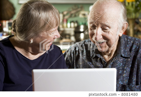 Senior Couple with a Laptop Computer Senior Couple with a Laptop Computer 8081480