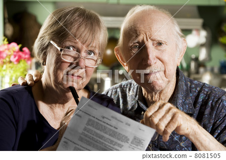 Elder Couple with Bills 8081505