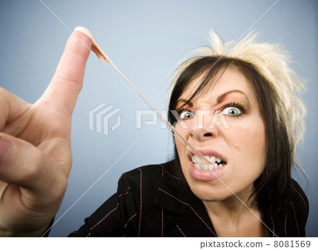 Creative Businesswoman with a Gum on her Finger Creative Businesswoman with a Gum on her Finger 8081569