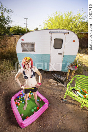 Woman outside a trailer 8081716