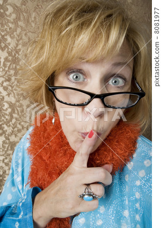 Crazy woman signaling for quiet 8081977