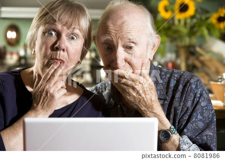 perplexed Senior Couple with a Laptop Computer perplexed Senior Couple with a Laptop Computer 8081986