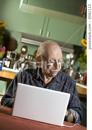 Senior Man with a Laptop Computer 8082113