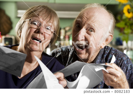 Elder Couple with Bills Elder Couple with Bills 8082183