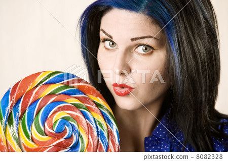 Pretty woman with a lollipop Pretty woman with a lollipop 8082328