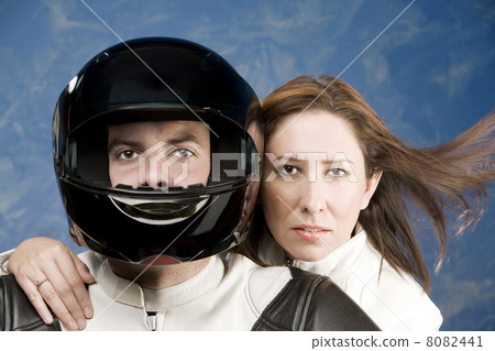 Man and woman on a motorcycle Man and woman on a motorcycle 8082441