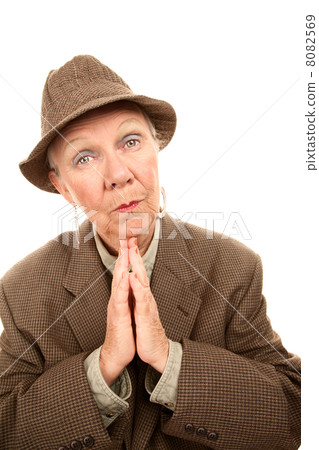 Senior woman in male clothes giving blessing Senior woman in male clothes giving blessing 8082569
