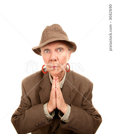 Senior woman in male clothing with hands together Senior woman in male clothing with hands together 8082690