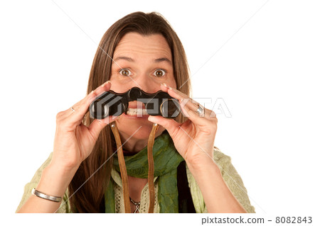 Woman using binoculars 8082843