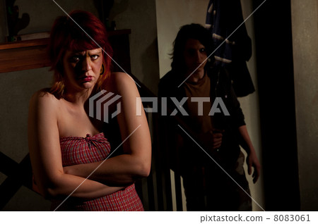 Frightened young woman Frightened young woman 8083061