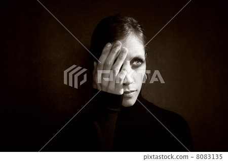 Pretty Woman with hand over her face 8083135