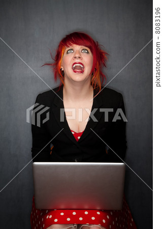 Punky Girl with Red Hair with Laptop Computer 8083196