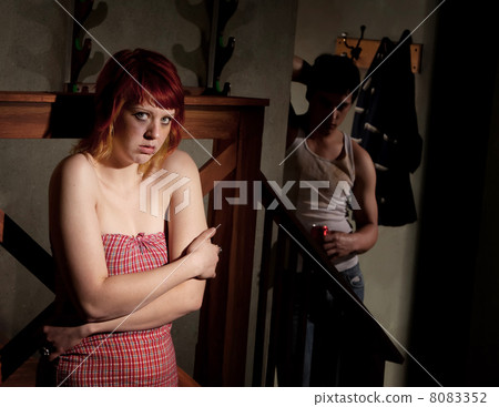 Frightened young woman 8083352