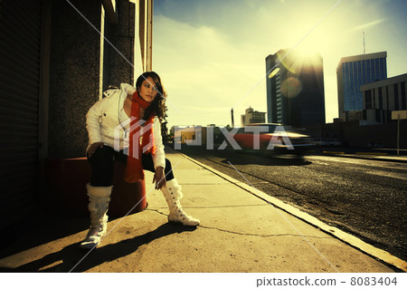 Pretty woman at sundown in city Pretty woman at sundown in city 8083404
