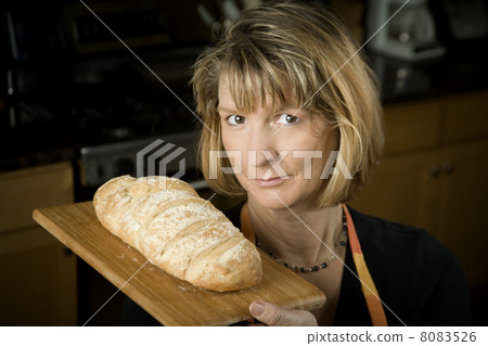 Woman in Kitchen with Bread 8083526