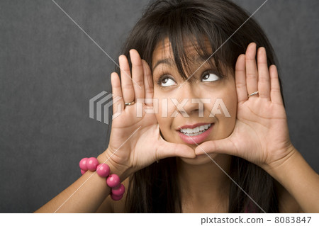 Woman framing her face Woman framing her face 8083847