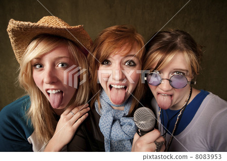 Three Young Girls with Microphone and Tongues Out 8083953