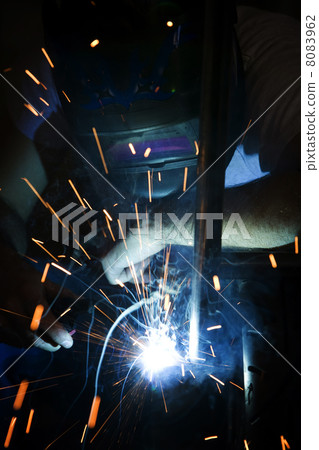 Welder working on motorcycle 8083962