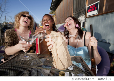 Three women drinking alcohol 8084107